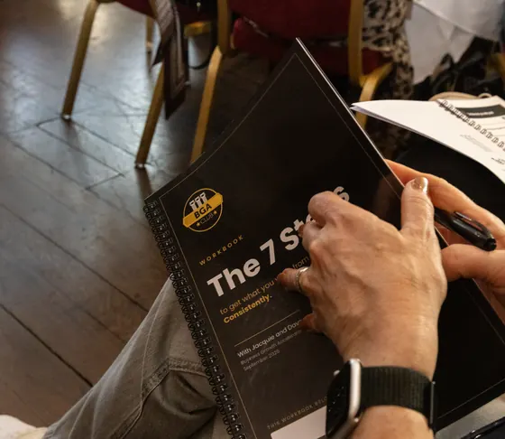 The BGA Club 7 Steps workbook in a member's hands